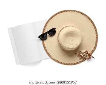 Summer essentials with hat, sunglasses, seashell and open book