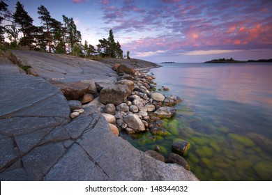 Summer Evening Landscape With Sea Coast And Alga Covered Stones From Uutela Nature Park, Finland