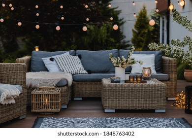 Summer evening on the patio of beautiful suburban house with garden - Shutterstock ID 1848763402