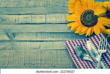 Summer Or Fall Picnic Place Setting With Sunflower On Rustic Wood Board Background With Room Or Space For Copy, Text, Your Words.  Horizontal Instagram