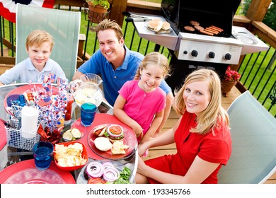 Summer: Family Holiday Dinner Outside On Deck