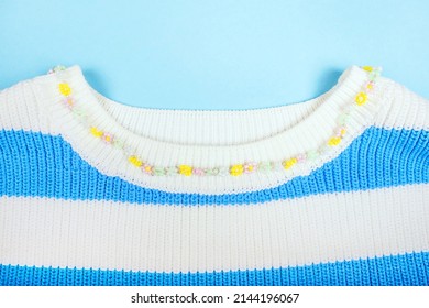 Summer Fashion Flatlay With Striped Crop Top And Beaded Necklace Isolated On Beige Background.