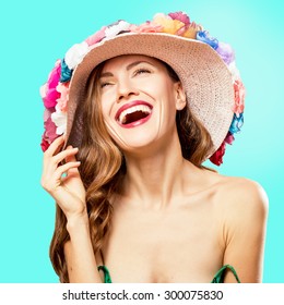 Summer fashion girl wearing hat over vibrant blue background