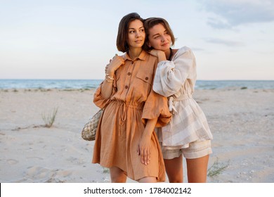 Summer Fashion Image Of Two  Brunette European Women In Linen Clothes. 