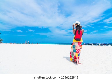 Summer fashion lifestyle traveler woman joy relaxing on white sand beach, Bamboo island, Andaman sea, Krabi, Travel Thailand, Beautiful destination landscape Asia, Summer holiday outdoor vacation trip