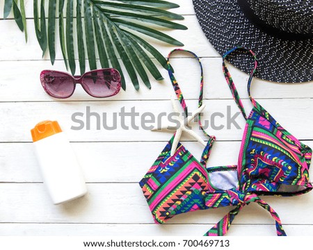 Summer Fashion woman bikini, big hat and accessories and sunglasses go to travel in the beach. Tropical sea.Unusual top view,  background.  Summer Concept