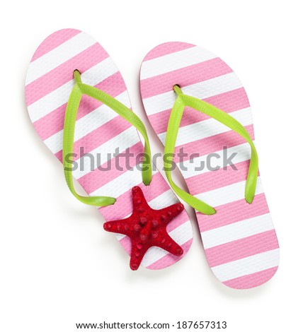 Summer flip flops with starfish on white background. Top view 