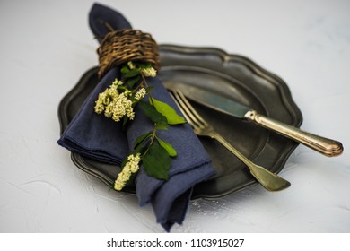 Summer floral rustic table setting on white concrete background with copy space