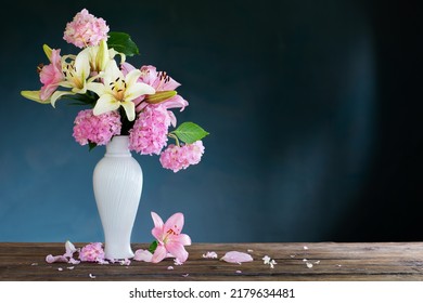 Summer Flowers In White Vintage Vase On Dark Background