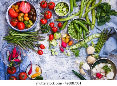 Summer Food Table With Variety Vegetables Tomatoes, White And Red Radish, Green Peas And Beans, Pepper, Spinach Leaves, Asparagus. Top View.