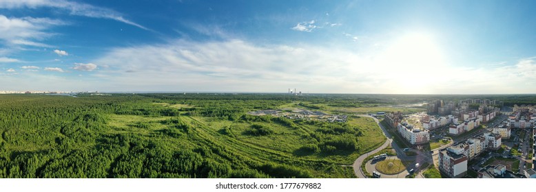 Summer Forest And Green Field Near City. Panorama. Nobody. Aerial View From Drone