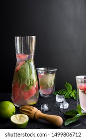 Summer Fresh Fruit Flavored Infused Water Mix Of Watermelon, Lime And Basil On Black Background. Copy Space.