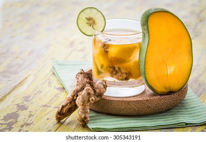 Summer fresh fruit Flavored infused water mix of mango and ginger - Powered by Shutterstock