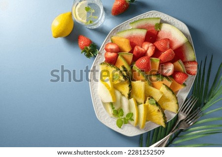 Summer fresh fruits assortment platter antipasti, watermelon, pineapple, melon and strawberries. 