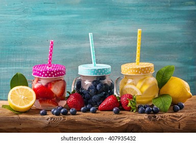 Summer Fruit Drinks On A Wooden Table