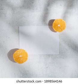 Summer Fruit Flat Lay Created With Copy Space Paper And Lemon Slices In The Palm Tree Shadow. Minimal Modern Concept.