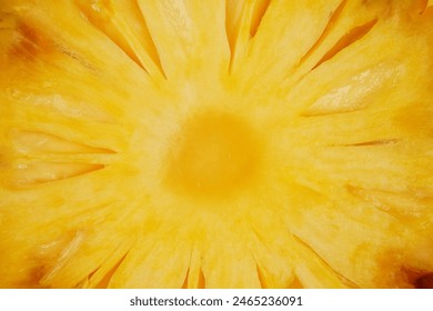 Summer fruit pineapple background concept macro shot of juicy yellow pineapple slice texture