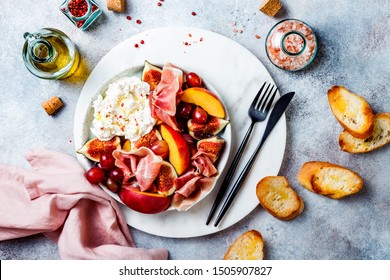 Summer Fruit Salad With Burrata, Peaches, Figs, Grapes, Jamon Or Prosciutto And Toasted Bread. Top View, Overhead