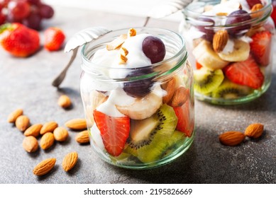 Summer fruit salad with cream and dry almonds
