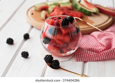 Summer Fruit Salad Of Watermelon Flesh In A Glass Piala, Slices Of Watermelon And Blackberries, Toned Image, Selective Focus