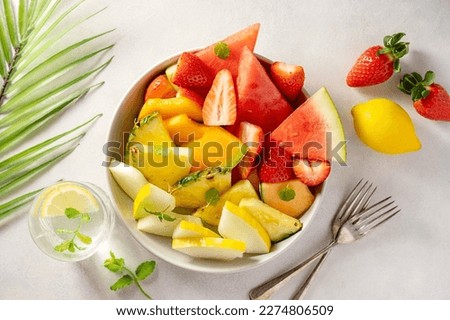 Summer fruits assortment platter antipasti, watermelon, pineapple, melon and strawberries. 