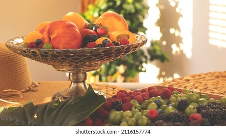 Summer fruity berry background. Table with berries and fruits. Summer breakfast, vacation, morning, sun. Berries, raspberries, blackberries, gooseberries. Vase with berries and fruits.  - Shutterstock ID 2116157774