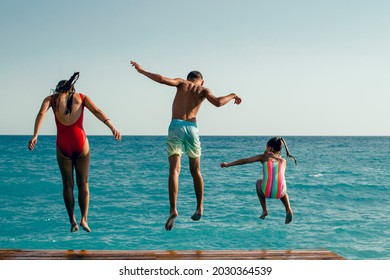 Summer Fun - Kids Jumping To The Water, Look From Behind