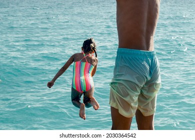 Summer Fun - Kids Jumping To The Water, Look From Behind