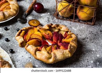 Summer Galette With Berries, Raspberry, Blueberry, Blackberry, Apple And Crusty Sugar Vegetarian Dough. Vegan Food. Healthy Food. Peach Pie. Tart. Summer Food, Summer Pie On Parchment Paper