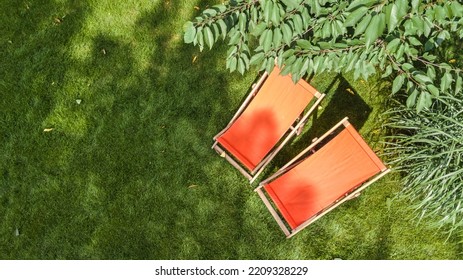 Summer Garden With Sunbed Deckchairs On Grass Aerial Top View, Green Park Trees And Place For Relax From Above