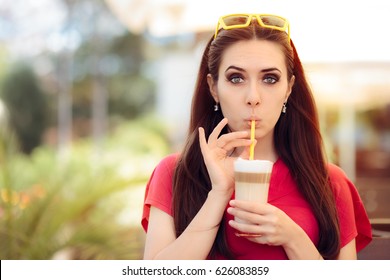 Summer Girl and Sipping Coffee Drink Trough a Straw - Funny woman at a restaurant in summertime 
 - Powered by Shutterstock