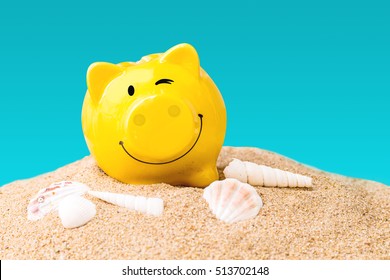 Summer Happy Piggy Bank On Sand Beach Over Isolated On Blue Background, Image For Saving Holiday Vacation Concept.