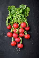 Summer Harvested Red Radish. Growing Organic Vegetables. Large Bunch Of Raw Fresh Juicy Garden Radish Set, On Black Stone Background, Top View Flat Lay