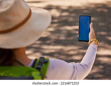 Summer, Hiking And Mockup Of Phone In Hand Of Woman On Adventure In City. Travel, Explore And Tourist Using Smartphone For Directions, Digital Map Or Fitness Tracking With Blue Screen For Marketing