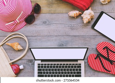 Summer Holiday Background With Laptop And Beach Items. View From Above