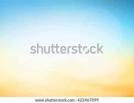 Summer holiday concept: Abstract blur blue, yellow and orange color sky beach sunset background