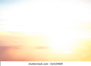 Summer Holiday Concept: Abstract Blurred White Sun Light Pattern On Autumn Sunrise Background