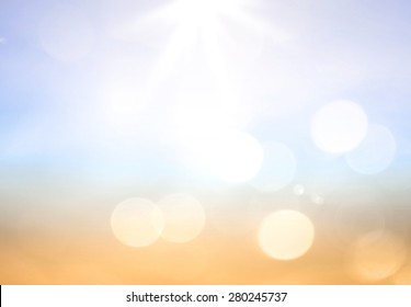 Summer Holiday Concept: Abstract Bokeh Light And Blurry Beautiful Blue Sky And Beach Sunrise Background