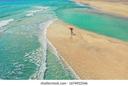 Summer Holiday Concept - Woman In Yoga Pose At The Beach On A Turquoise Sea Shot From Above. 