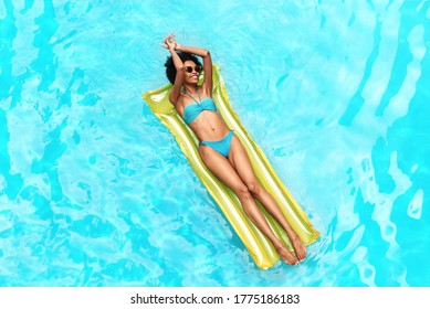 Summer Holiday Idyllic. Sexy Black Girl Relaxing On Lilo In Swimming Pool, Top View