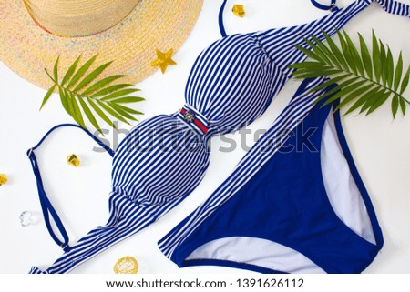 Summer holiday vacation concept. Beach accessories top view. Overhead view of woman's swimwear and beach accessories. Summer background. Flat lay, top view. .Summer swimsuit bikini fashion.