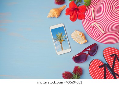 Summer Holiday Vacation Concept  With Smartphone And Beach Items. View From Above. Flat Lay