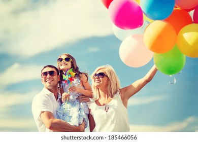 Summer Holidays, Celebration, Children And People Concept - Family With Colorful Balloons