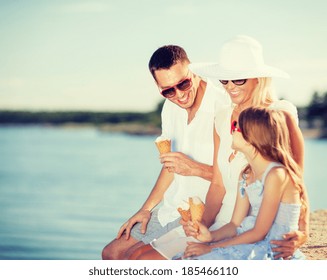 Summer Holidays, Celebration, Children And People Concept - Happy Family Eating Ice Cream