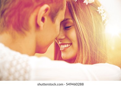 summer holidays, love, romance and people concept - happy smiling young hippie couple hugging outdoors - Shutterstock ID 549460288