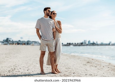 summer holidays and people concept - happy couple on beach in tallinn, estonia - Powered by Shutterstock