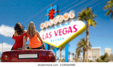 Summer Holidays, Road Trip And Travel Concept - Happy Friends Driving In Convertible Car Over Welcome To Fabulous Las Vegas Sign Background