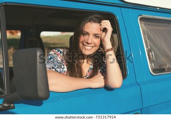 summer holidays, road trip, travel and\
people concept, young woman resting in minivan\
car