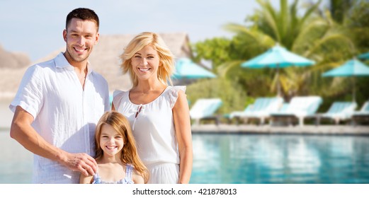 Summer Holidays, Travel, Tourism, Vacation And People Concept - Happy Family Over Hotel Resort Swimming Pool And Sun Beds Background