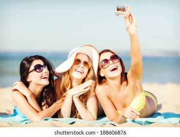 Summer Holidays, Vacation And Beach Concept - Girls In Bikinis Taking Selfie On The Beach